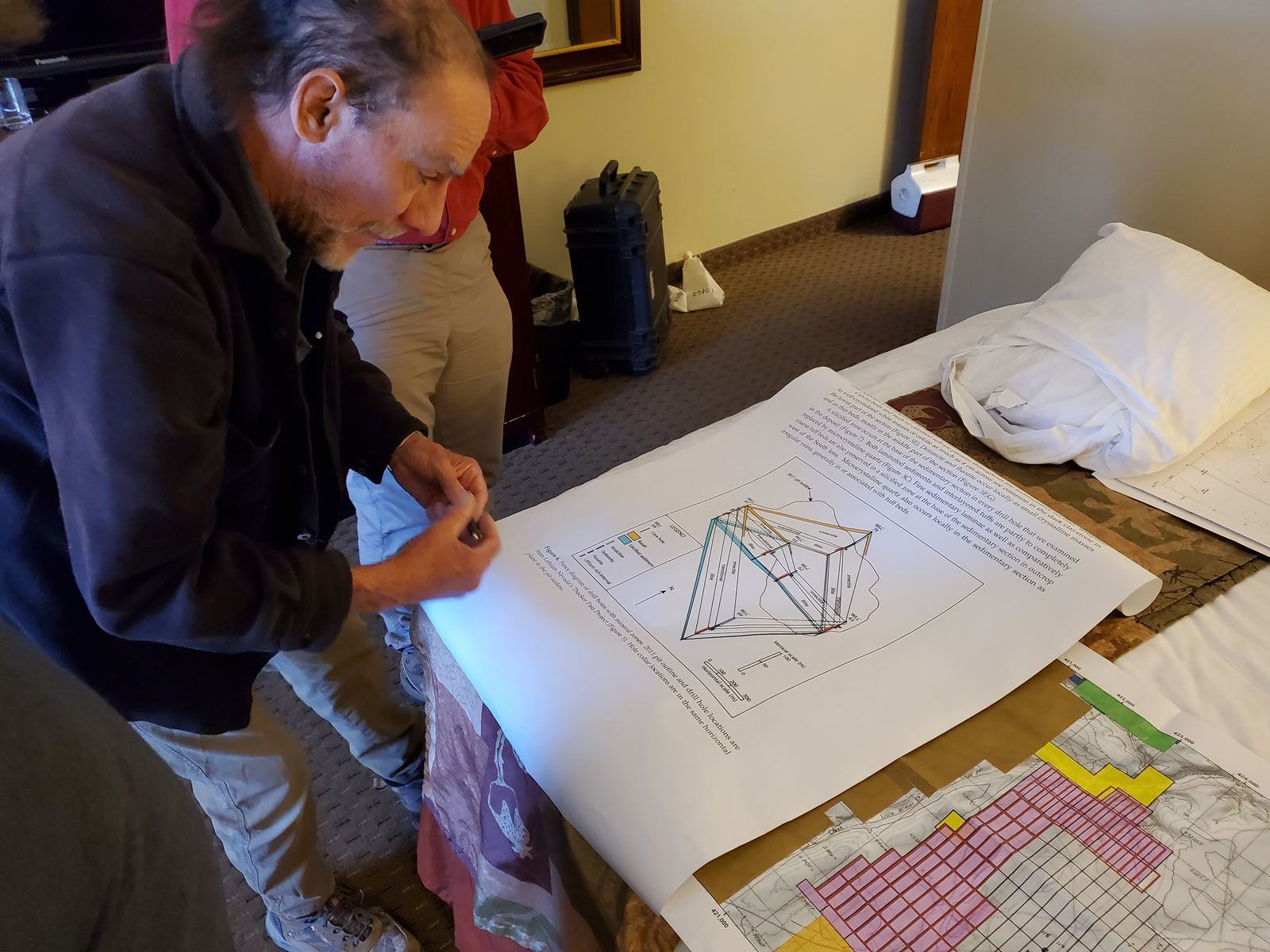 Team reviewing project maps, October 2022